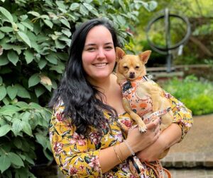 woman holding smiling chihuahua
